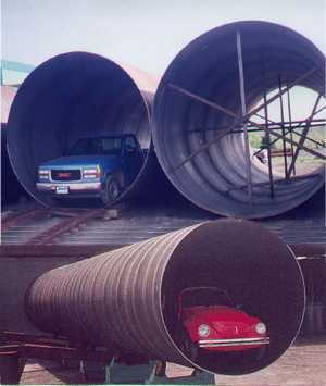 Tuyaux spiralés de grande dimension - démonstration d'échelle avec véhicules